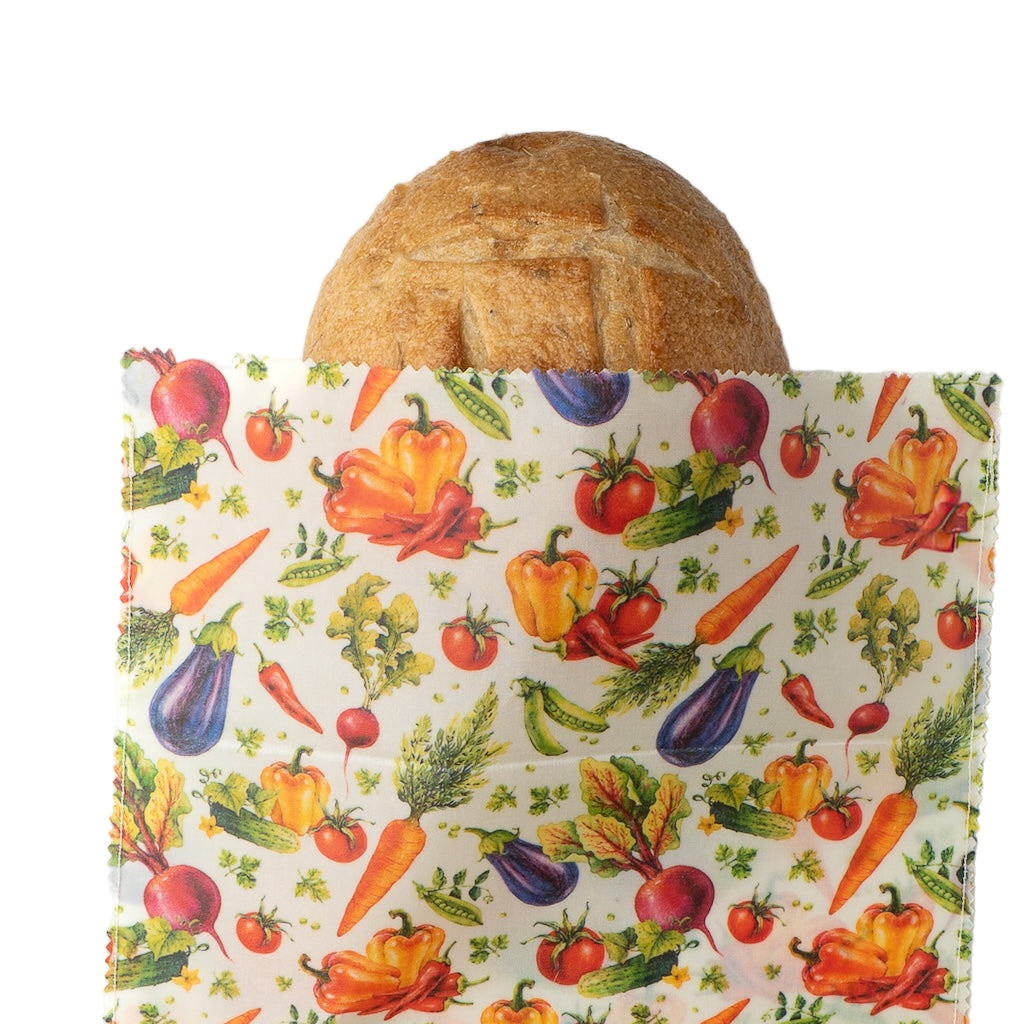 Reusable shopping bag with colorful vegetable pattern on a white background